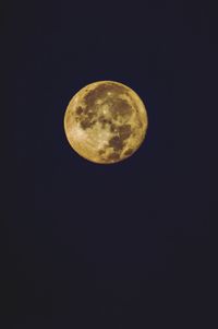 Low angle view of moon against sky at night