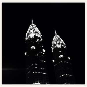 Low angle view of illuminated buildings at night