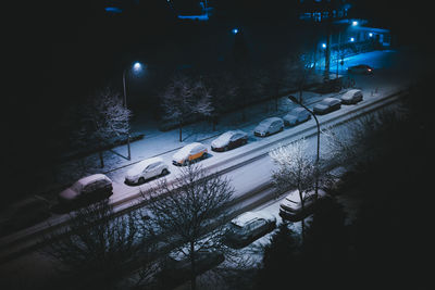 High angle view of illuminated road in winter at night