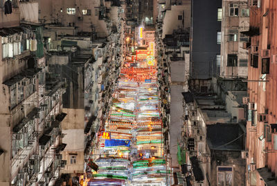 High angle view of illuminated buildings in city at night