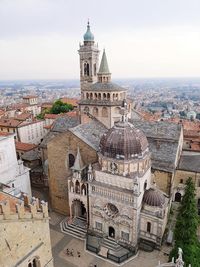 High angle view of city buildings against sky