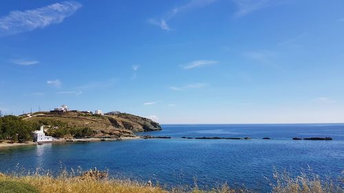 Scenic view of sea against blue sky