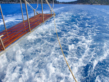 Sailboat sailing in sea against sky