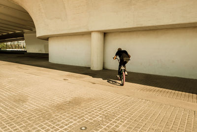 Man riding bicycle in city