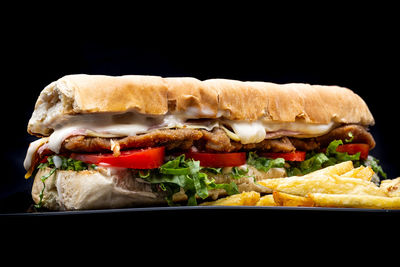 Food served on table against black background