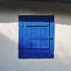 Closed blue door of building