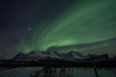 Scenic view of aurora borealis over lyngen alps