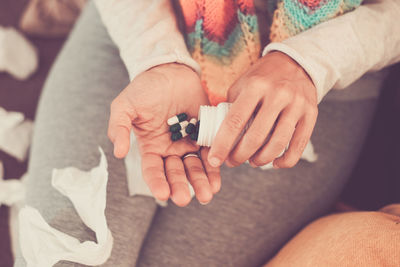 Midsection of man holding hands