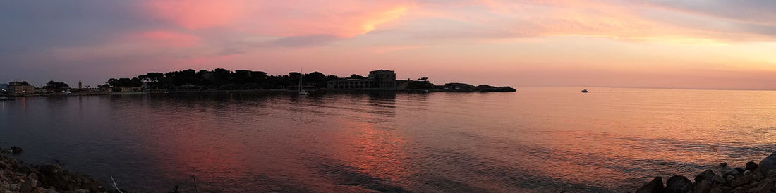 View of calm sea at sunset