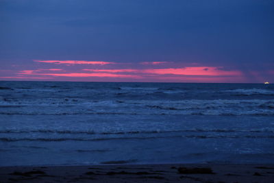 Scenic view of sea against sky at sunset