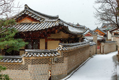 Traditional building against sky during winter