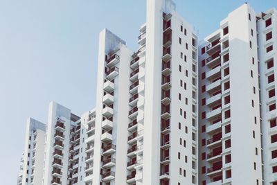 Low angle view of modern buildings against sky