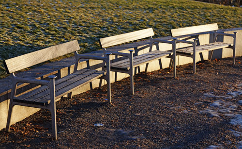 High angle view of empty chairs and table at beach