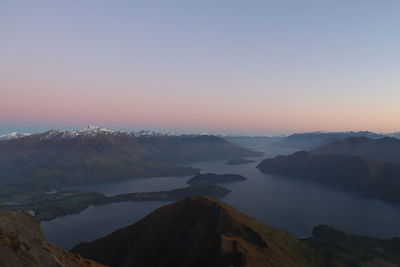 Scenic view of mountains against clear sky during sunset