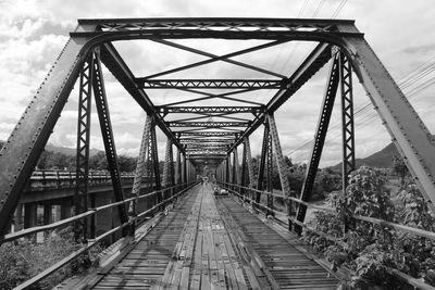 Low angle view of railroad bridge against sky