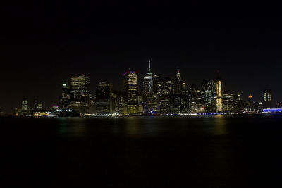 Illuminated buildings in city at night