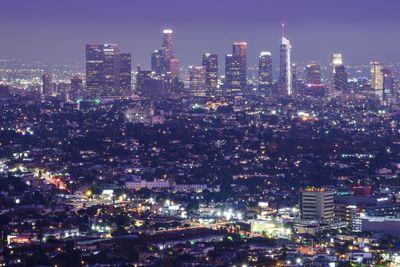 Illuminated buildings in city at night