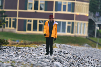 Full length portrait of man standing in city