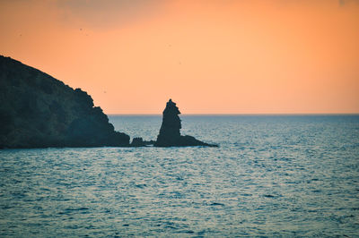 Scenic view of sea against clear sky during sunset