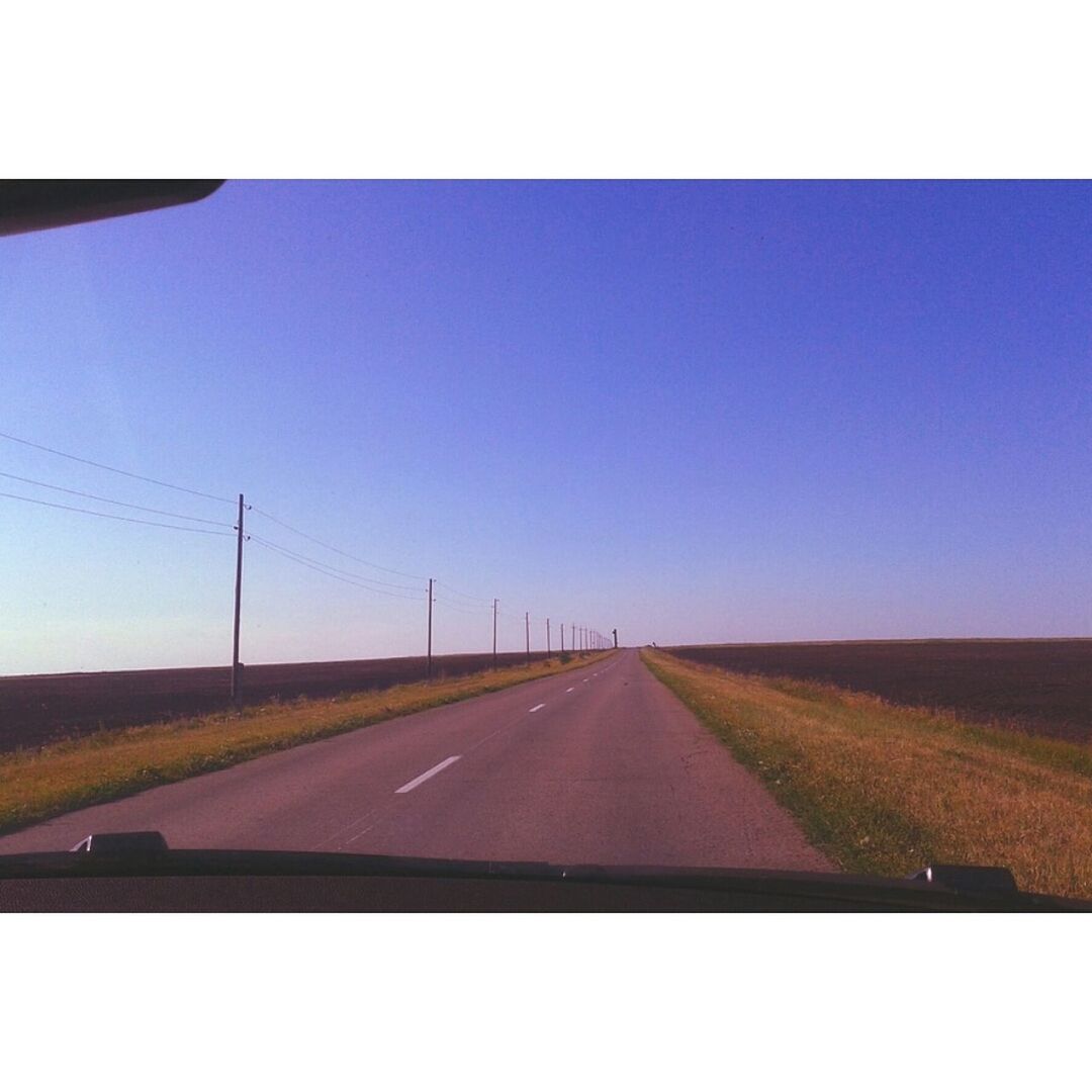 the way forward, transportation, road, diminishing perspective, vanishing point, road marking, clear sky, country road, landscape, transfer print, copy space, sky, blue, auto post production filter, tranquil scene, field, tranquility, long, empty road, empty