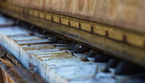 Close-up of abandoned piano