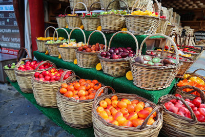 Fresh fruits on the basket like pomegranate, oranges, apple, peach in the village market turkey. 