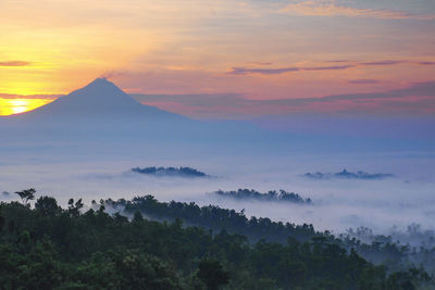 Scenic view of mountains against sky during sunset