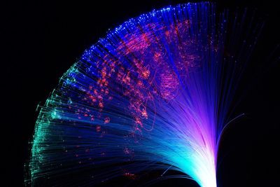 Low angle view of illuminated ferris wheel