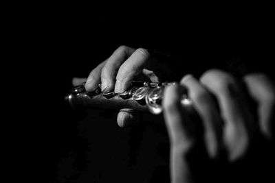 Hands of musician on flute musical instrument popular in classical brass marching jazz folk music