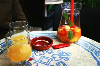 High angle view of drink with ashtray on table