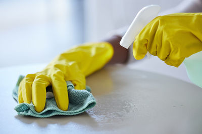 Cropped hand of scientist working on table