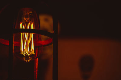 Close-up of illuminated light bulb