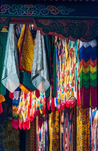 Multi colored textile hanging at market stall