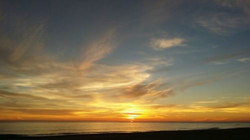 Scenic view of sea at sunset