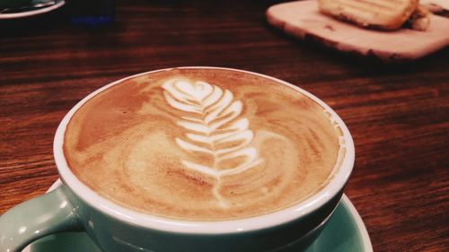 High angle view of cappuccino on table