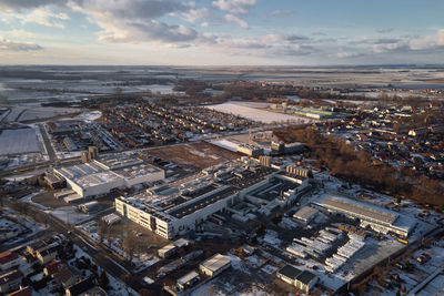 Logistic warehouse in suburban area, aerial view. industrial center with factory