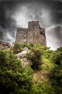 Low angle view of old ruin against sky