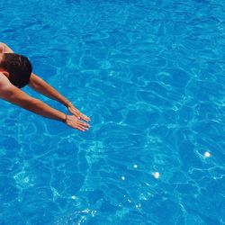 High angle view of woman swimming in pool