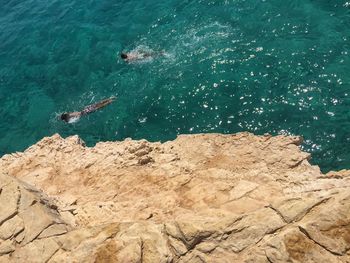 High angle view of rock in sea