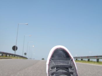 Close-up of road against clear sky