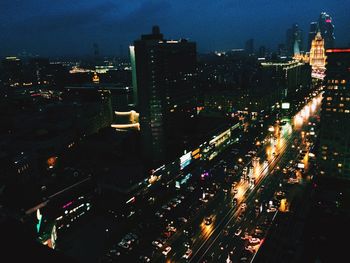 High angle view of illuminated cityscape at night