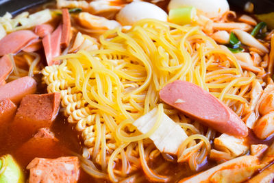 High angle view of noodles and meat