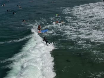 Surfer in mission beach , san diego , california wave surf ocean high angle view of people in sea