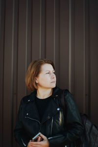 Close up portrait of a woman with wind in her hair .