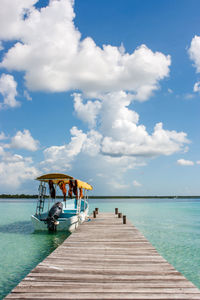 Pier over sea against sky