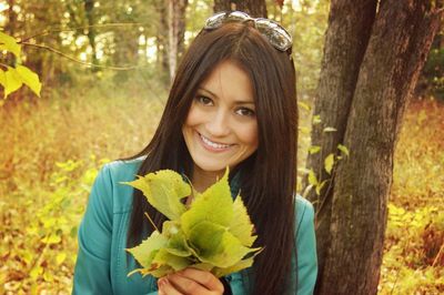 Portrait of young woman in park