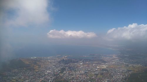 Aerial view of cityscape against sky