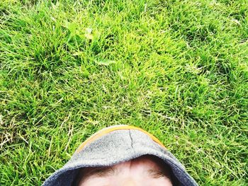 Man relaxing on grassy field