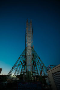 Low angle view of modern building against clear blue sky