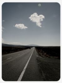Empty road along landscape